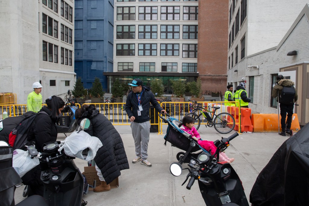 Migrant families leave the Hall Street shelter in the morning.